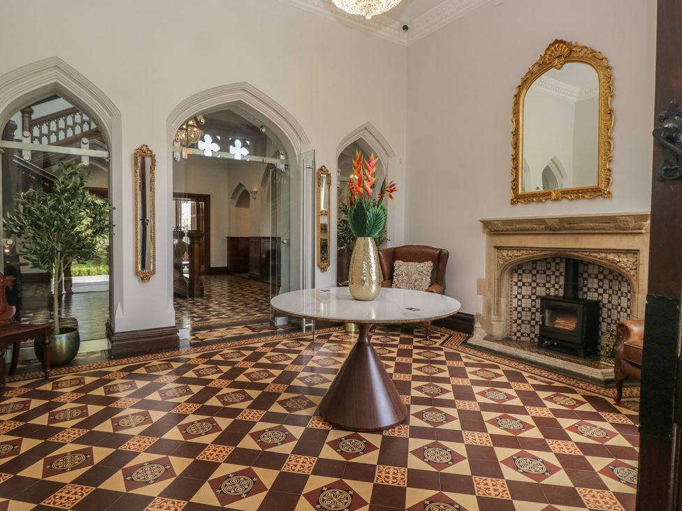 A lobby with a table and chairs at Brettargh Holt Mansion near Levens