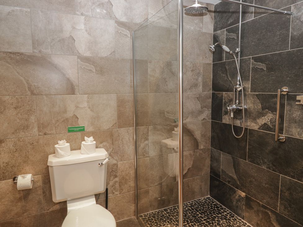 A bathroom with a shower and toilet at Brettargh Holt Mansion near Levens