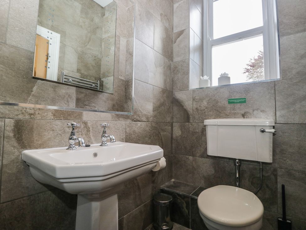 A bathroom with a sink and toilet at Brettargh Holt Mansion near Levens