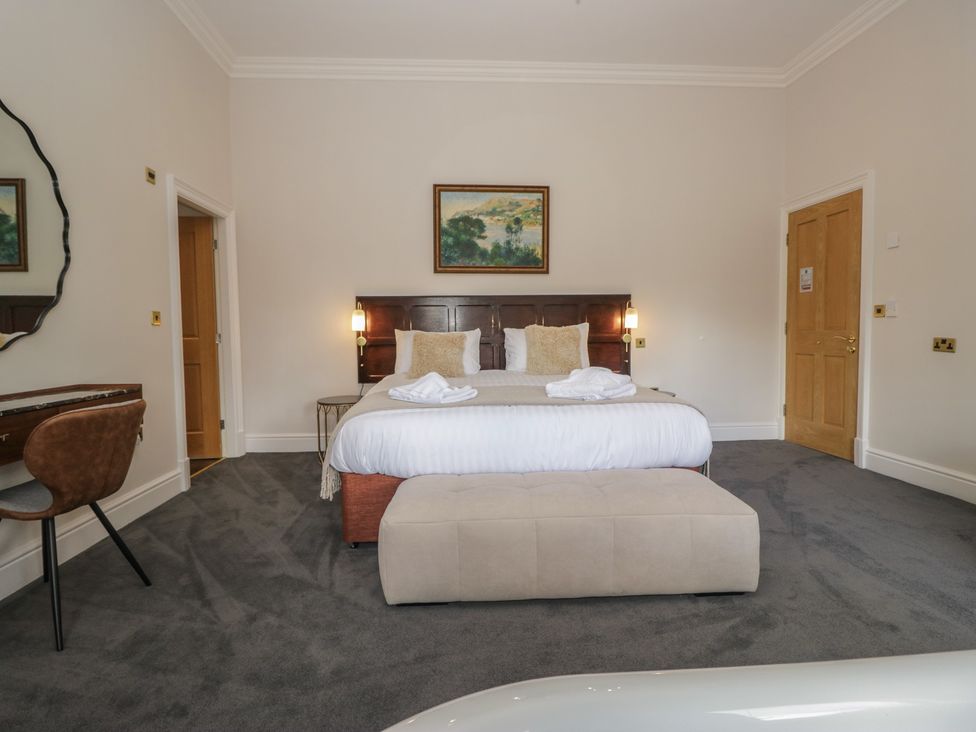 A bedroom with a bed and desk at Brettargh Holt Mansion near Levens