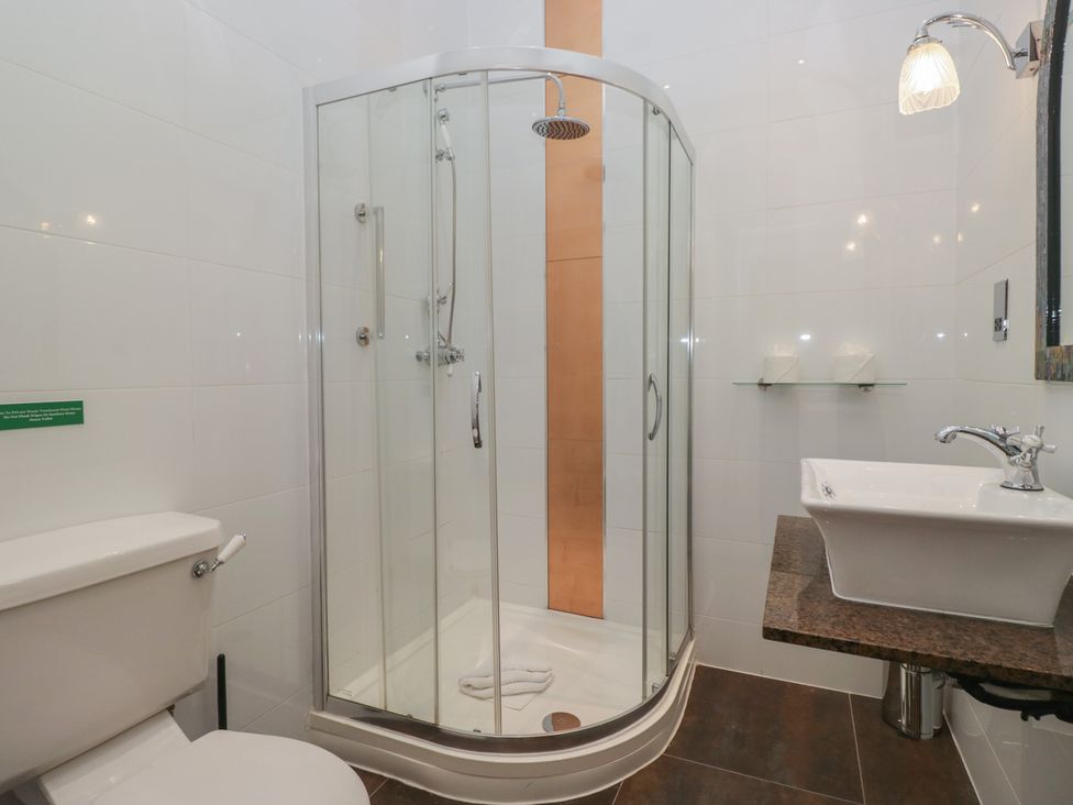 A bathroom with a shower and a sink at Brettargh Holt Mansion near Levens