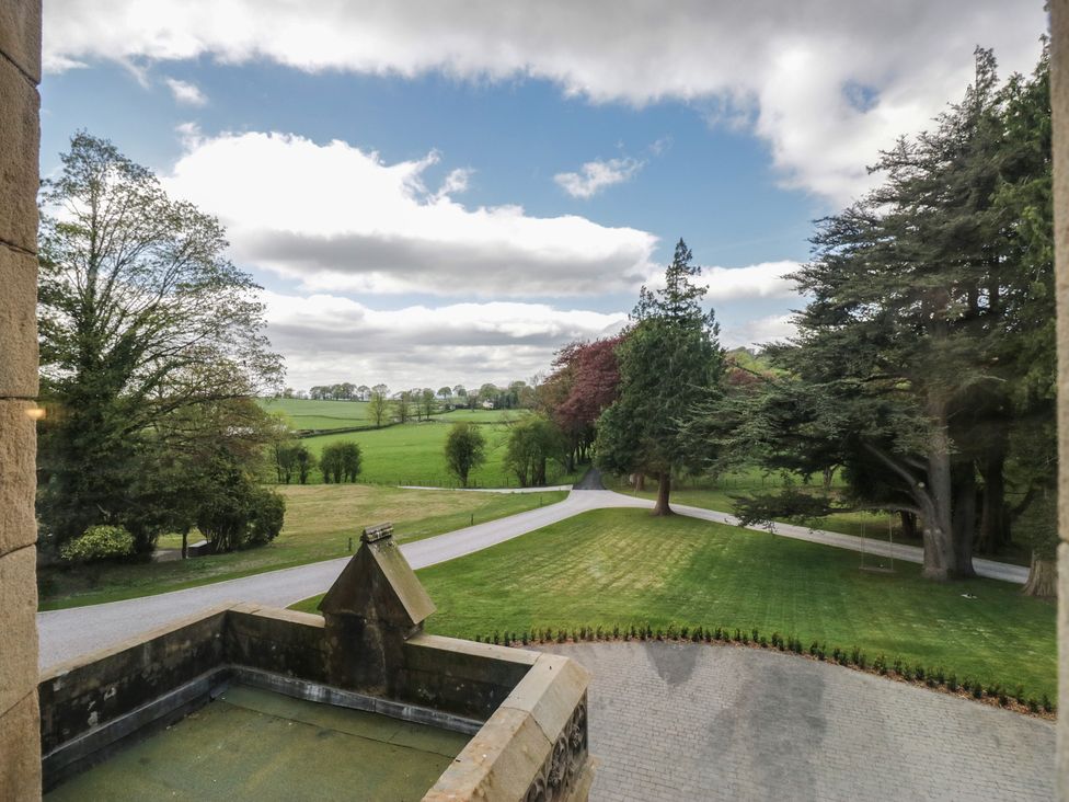 An outdoor area with trees and a driveway at Brettargh Holt Mansion near Levens
