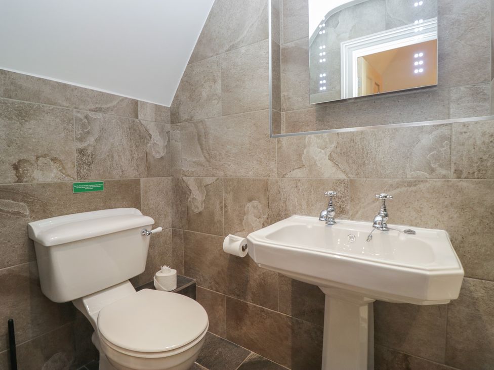 A bathroom with a toilet and a sink at Brettargh Holt Mansion near Levens