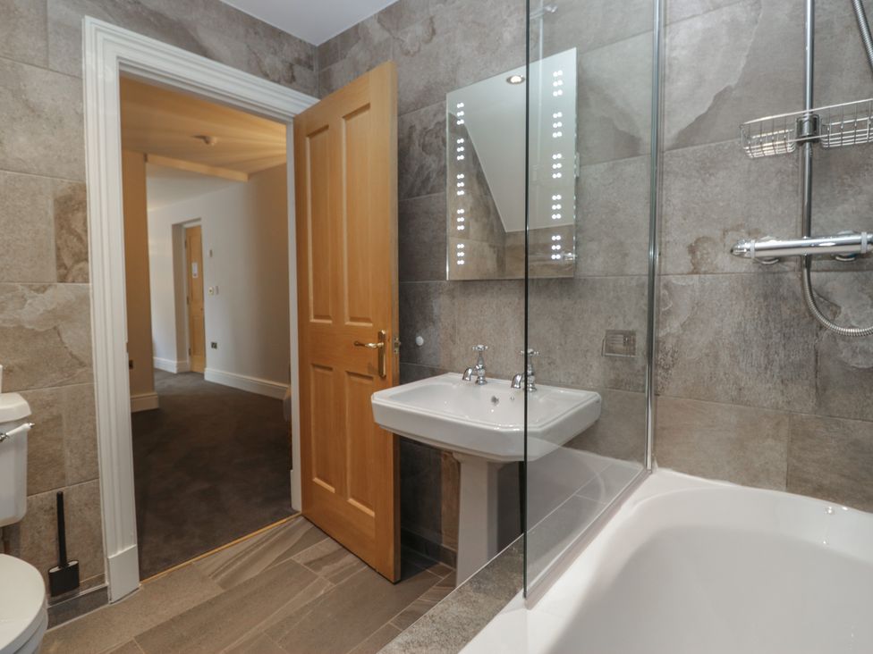 A bathroom with a sink and a bathtub at Brettargh Holt Mansion near Levens