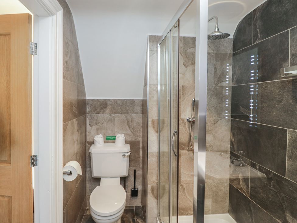 A bathroom with a shower and toilet at Brettargh Holt Mansion near Levens