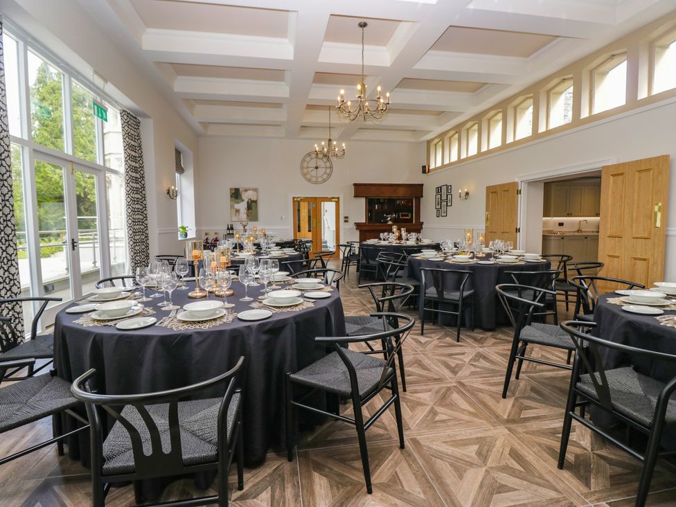 A dining room with tables set for a meal at Brettargh Holt Mansion near Levens