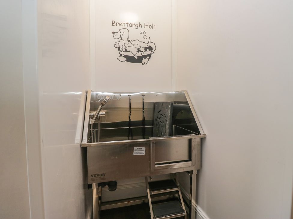 A dog wash area with tub and steps at Brettargh Holt Mansion near Levens