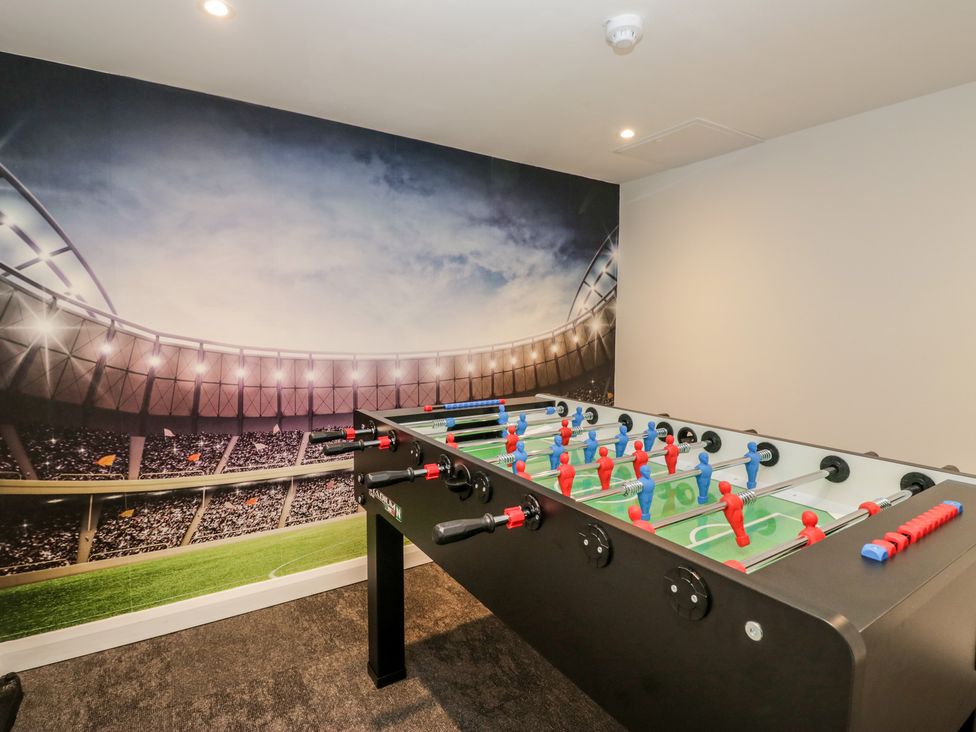 A foosball table in a game room at Brettargh Holt Mansion near Levens