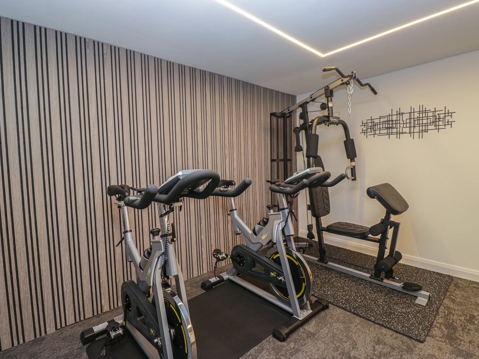 A gym with exercise equipment at Brettargh Holt Mansion near Levens