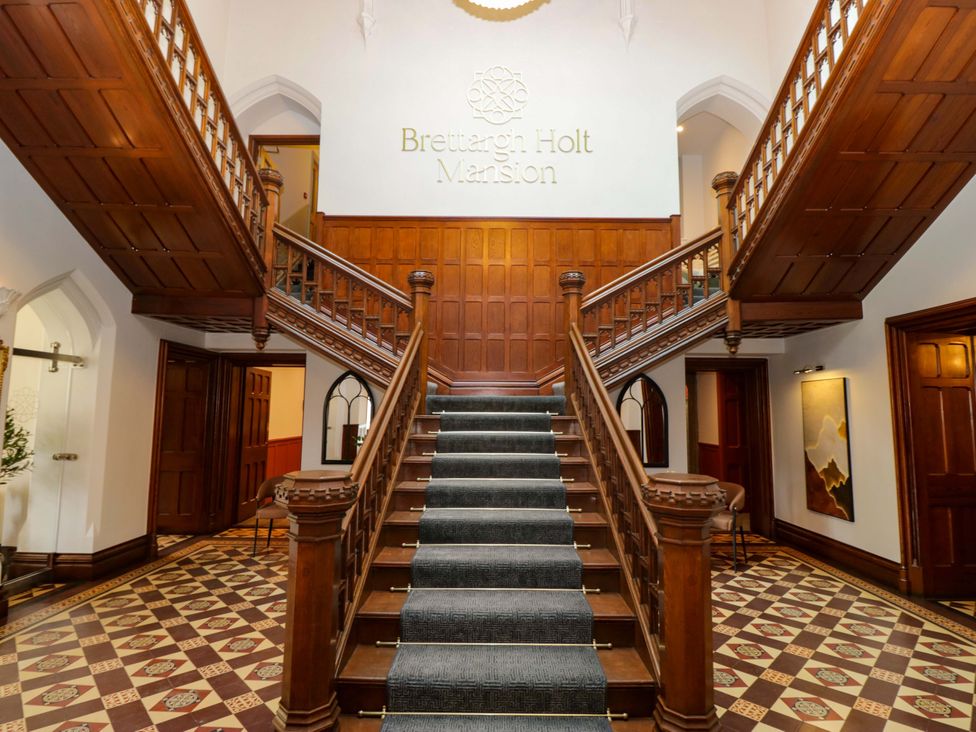 A staircase in the hallway at Brettargh Holt Mansion near Sizergh, Cumbria