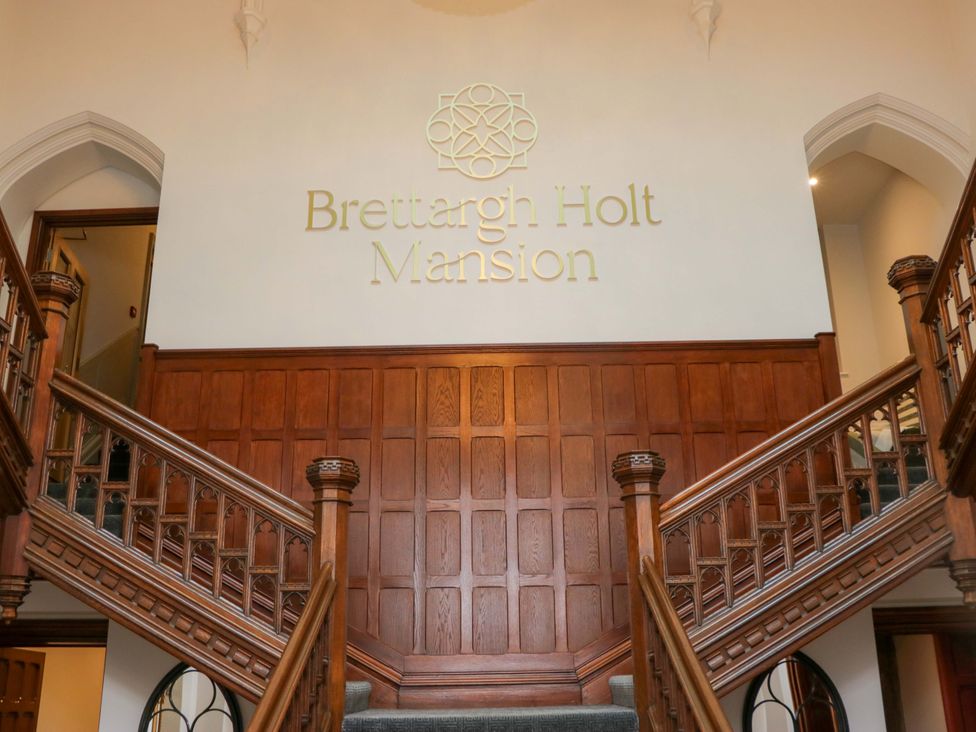 A staircase in the hallway at Brettargh Holt Mansion near Sizergh, Cumbria