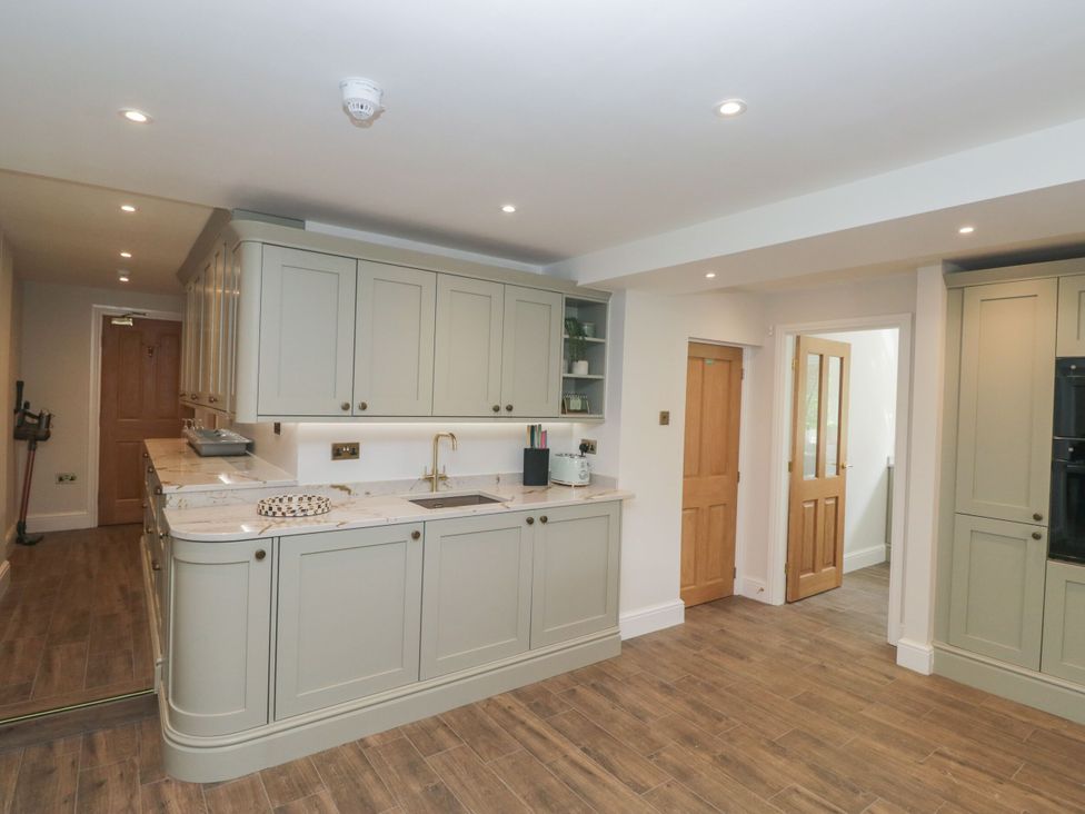 A kitchen with cabinetry and countertops at Brettargh Holt Mansion 32 near Levens