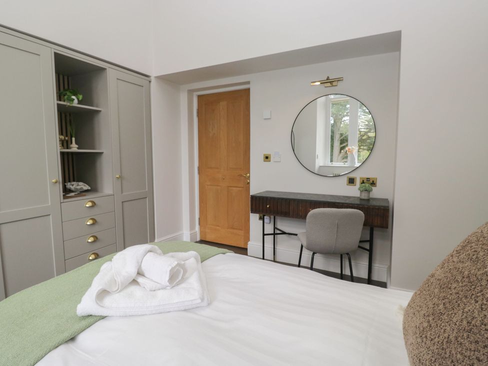 A bedroom with a bed and a desk at Brettargh Holt Mansion 32 near Levens