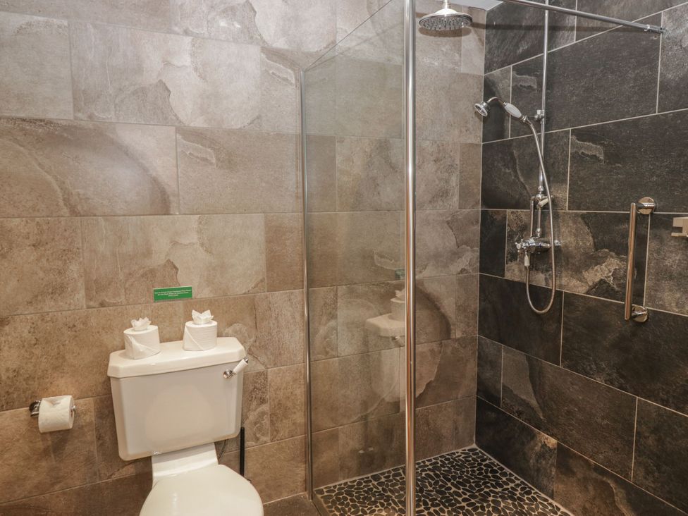 A bathroom with a shower and toilet at Brettargh Holt Mansion 32 near Levens