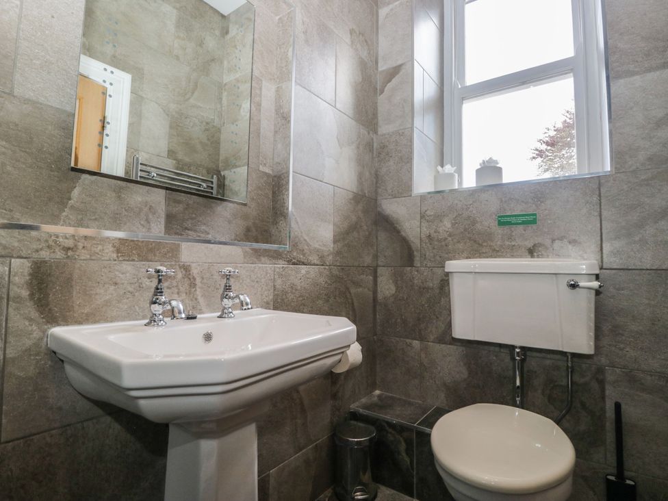 A bathroom with a sink and toilet at Brettargh Holt Mansion 32 near Levens