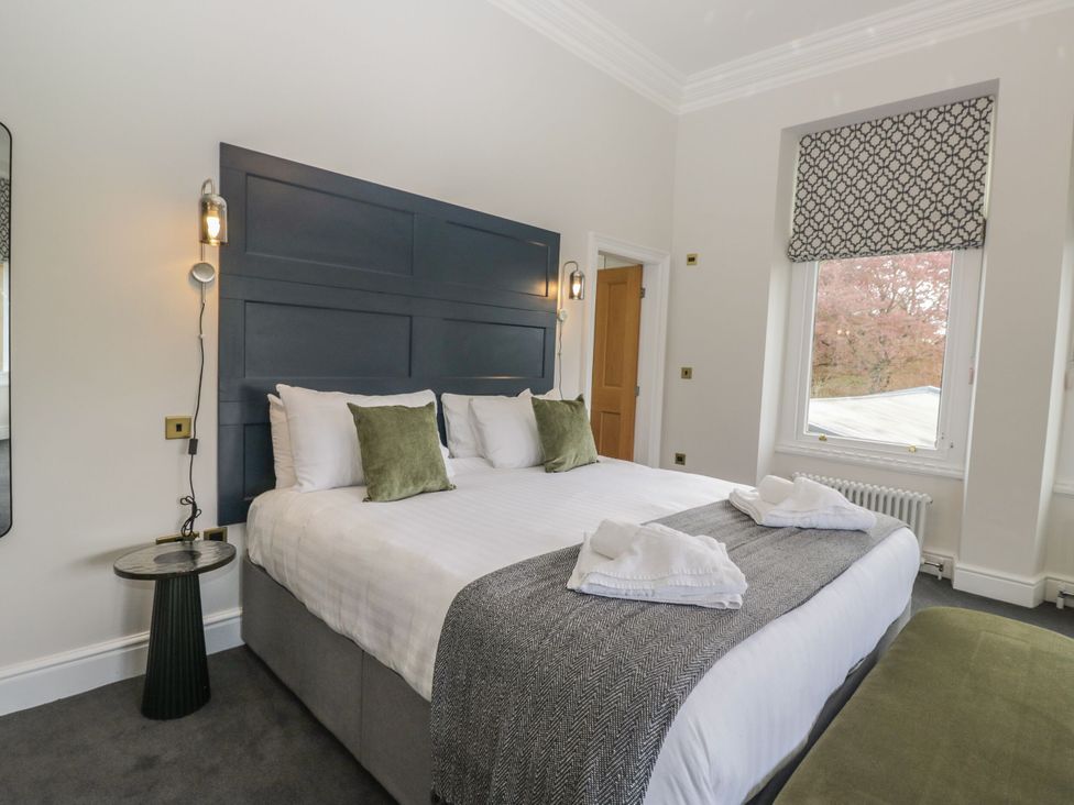 A bedroom with a bed and window at Brettargh Holt Mansion 32 near Levens