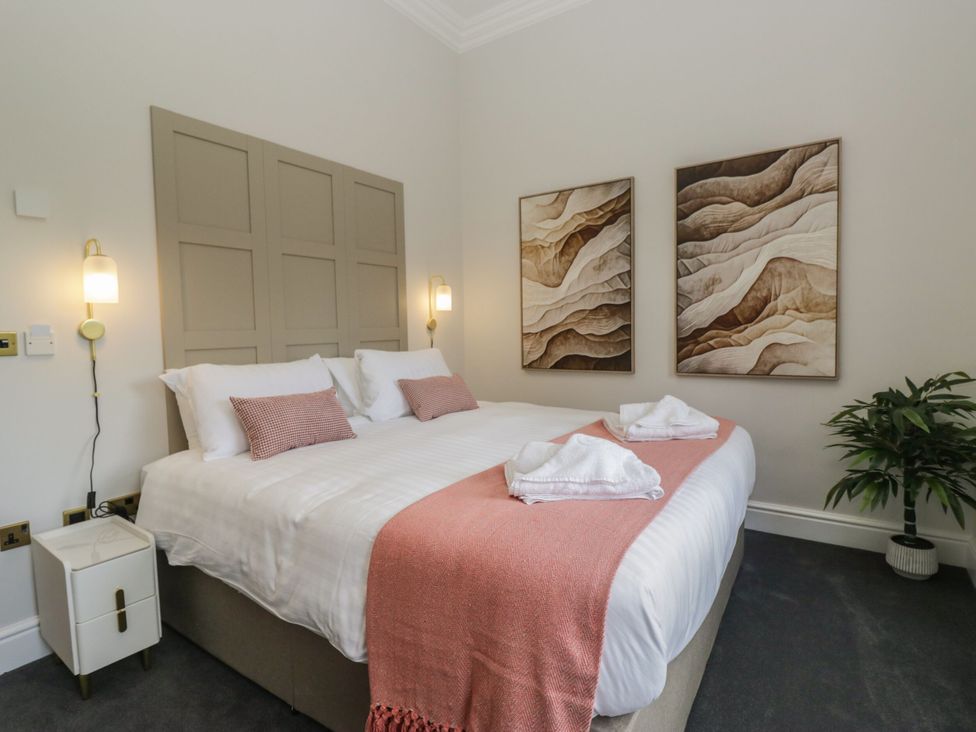 A bedroom with a bed and artwork at Brettargh Holt Mansion 32 near Levens