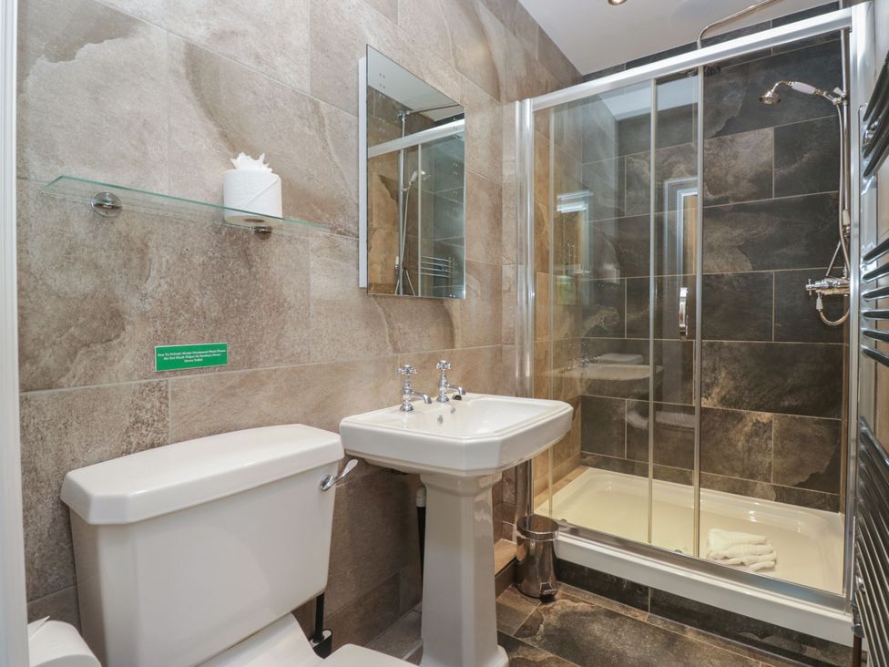 A bathroom with a shower and sink at Brettargh Holt Mansion 32 near Levens