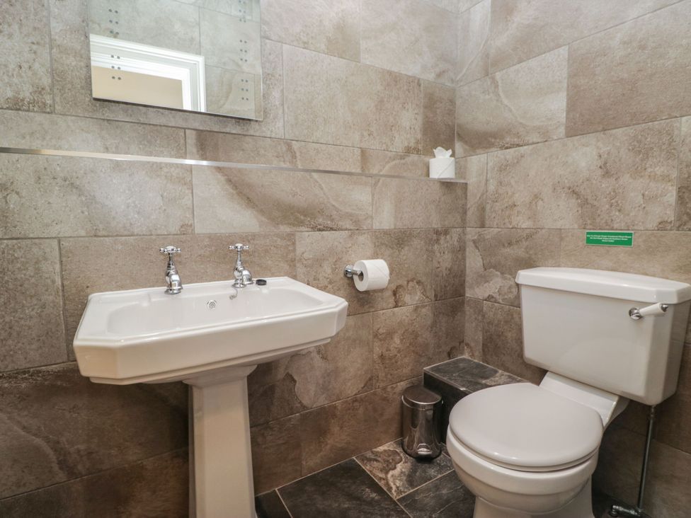 A bathroom with a sink and toilet at Brettargh Holt Mansion 32 near Levens