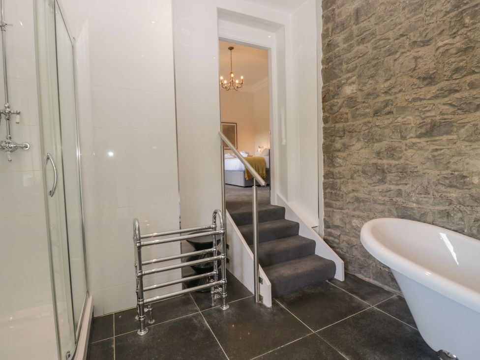 A bathroom with a shower enclosure and bathtub at Brettargh Holt Mansion 32 near Levens