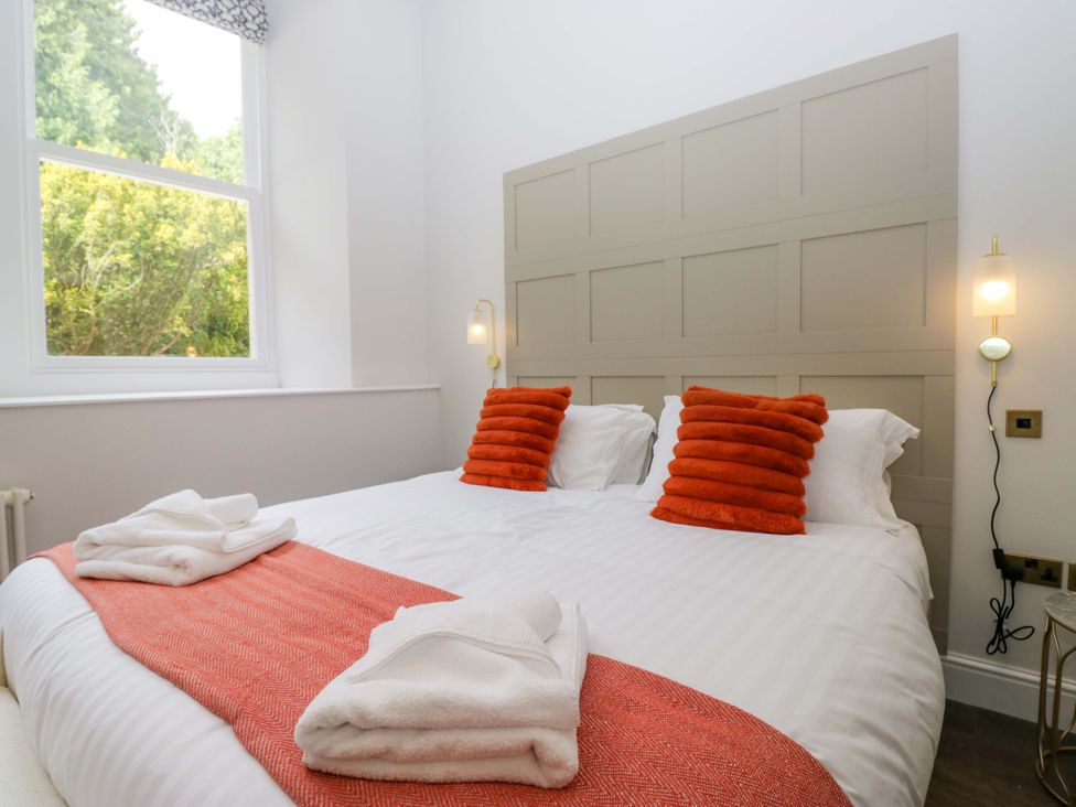A bedroom with a double bed and pillows at Brettargh Holt Mansion Sleeping 32 near Sizergh, Cumbria