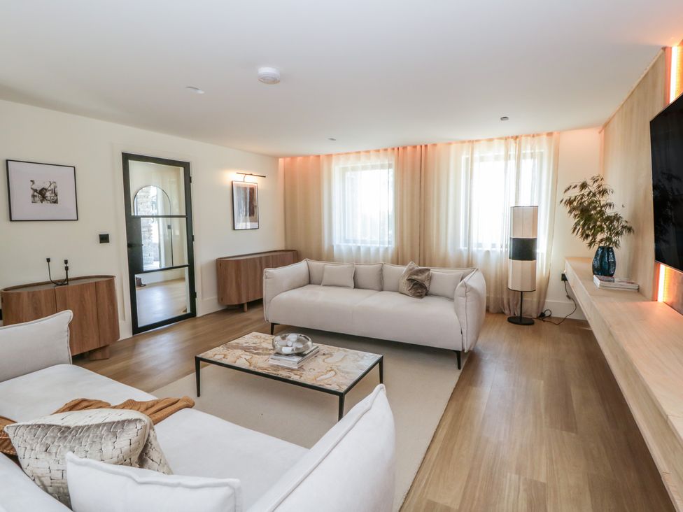 A living room with a coffee table and sofa at Brynseion Uchaf near Aberystwyth