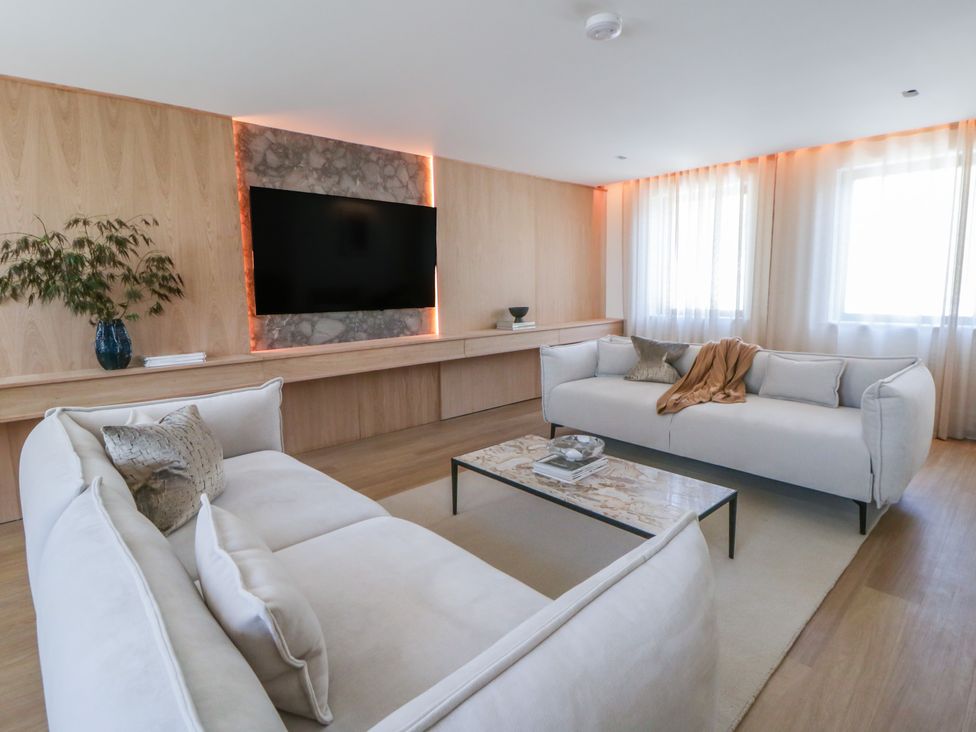 A living room with sofas and a coffee table at Brynseion Uchaf near Aberystwyth