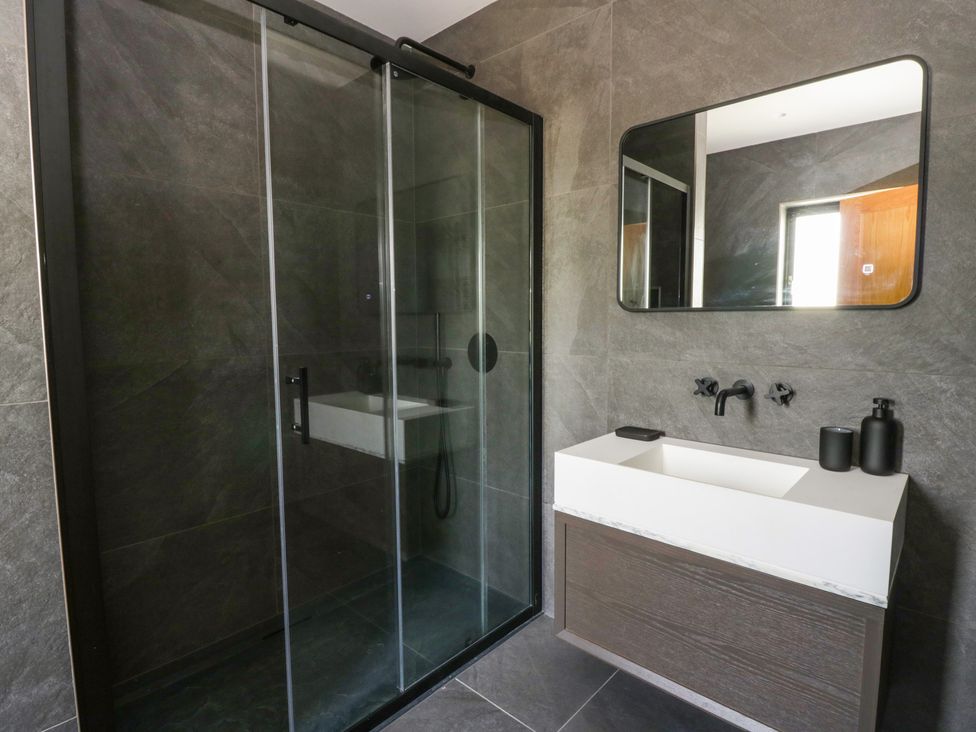 A bathroom with a shower and sink at Brynseion Uchaf near Aberystwyth