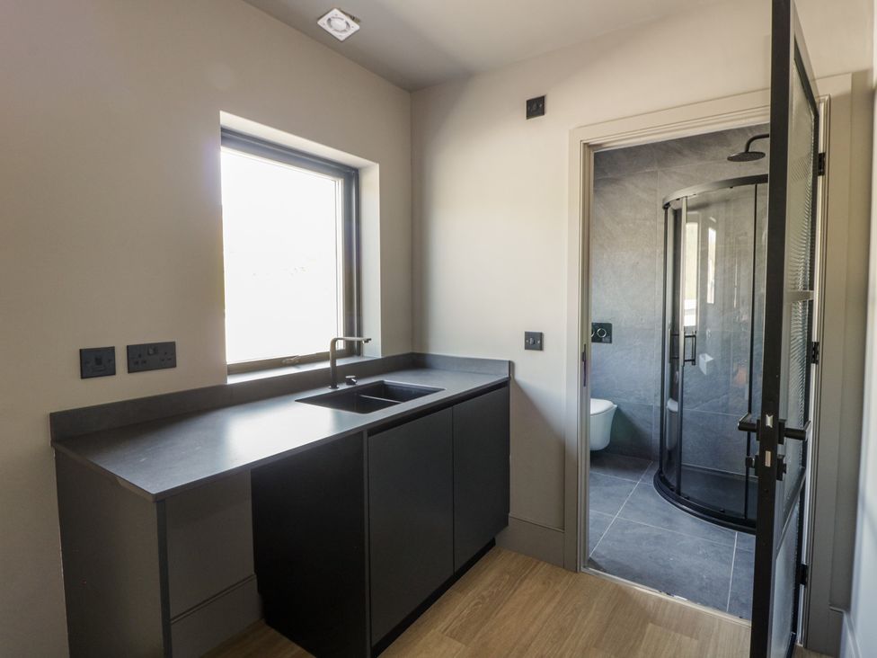 A bathroom with a sink and shower at Brynseion Uchaf near Aberystwyth
