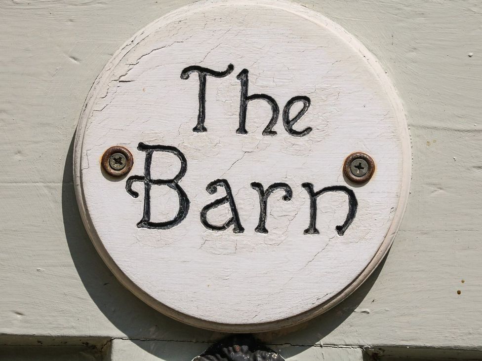 A sign that reads The Barn outside at The Barn