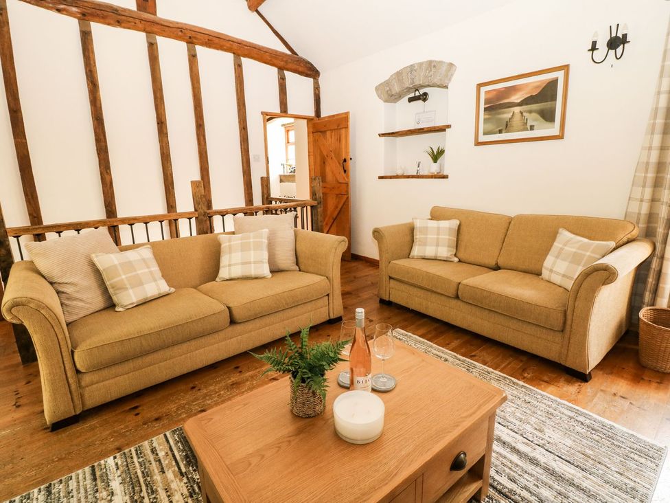 A living room with two sofas and a coffee table at The Barn 