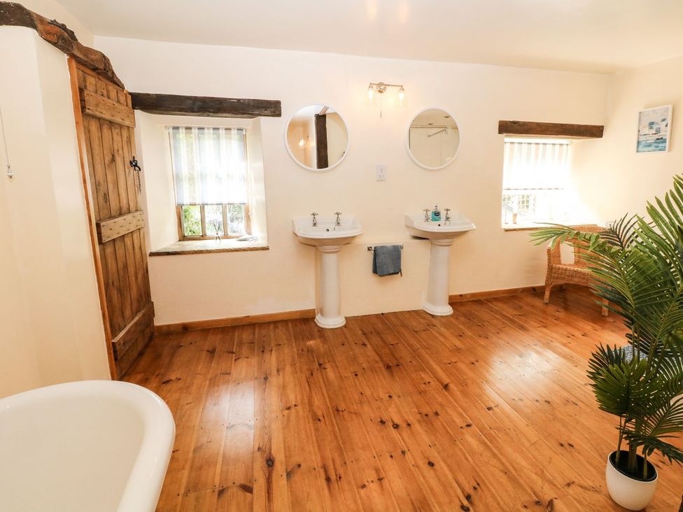 A bathroom with sinks and mirrors at The Barn in 