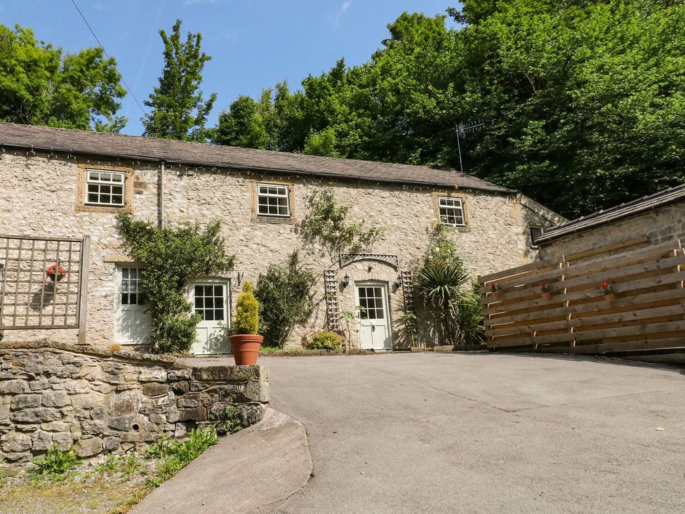 A stone building with a pathway and plants at The Barn in 