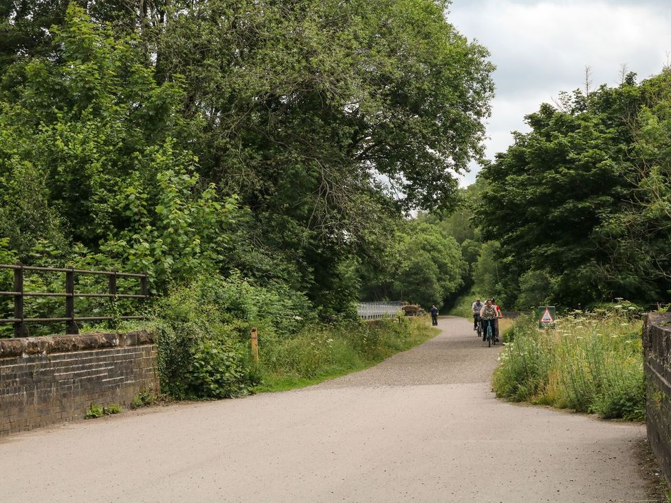 A path with trees and bikers at The Barn in 