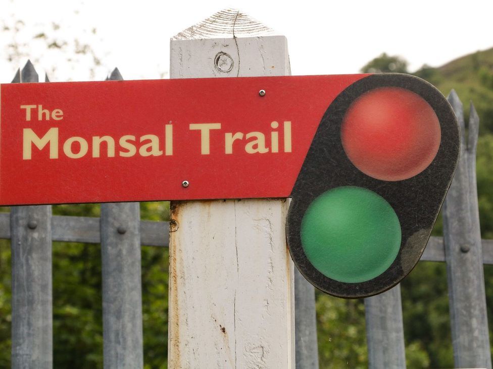 A sign for The Monsal Trail with traffic light symbols at The Barn