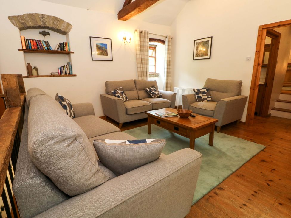 A living room with a sofa and armchairs at The Barn in Miller's Dale near Tideswell