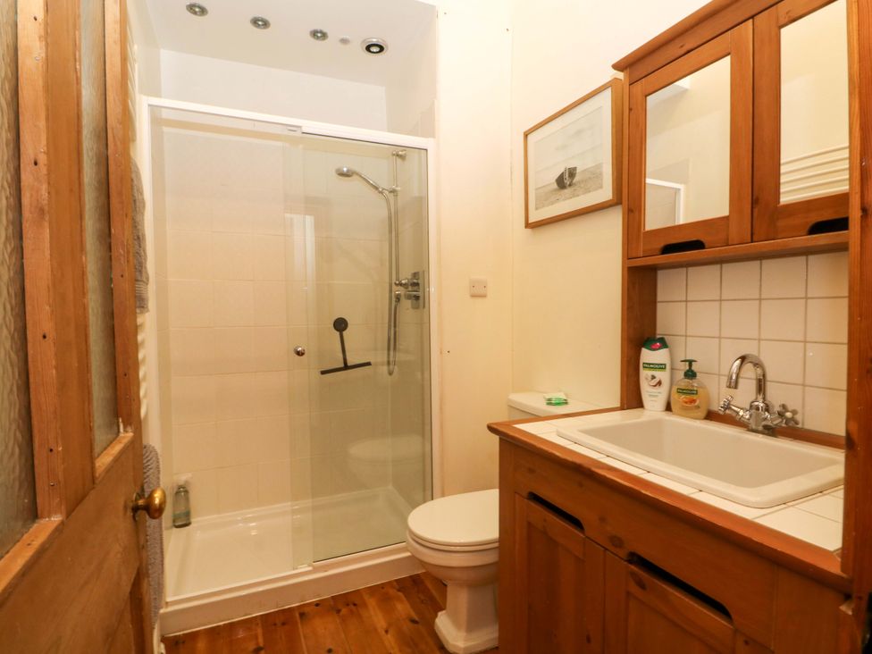 A bathroom with shower and sink at The Barn in Miller's Dale near Tideswell