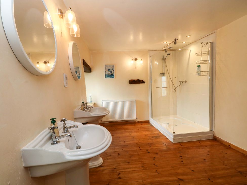 A bathroom with sinks and a shower at The Barn in Miller's Dale near Tideswell