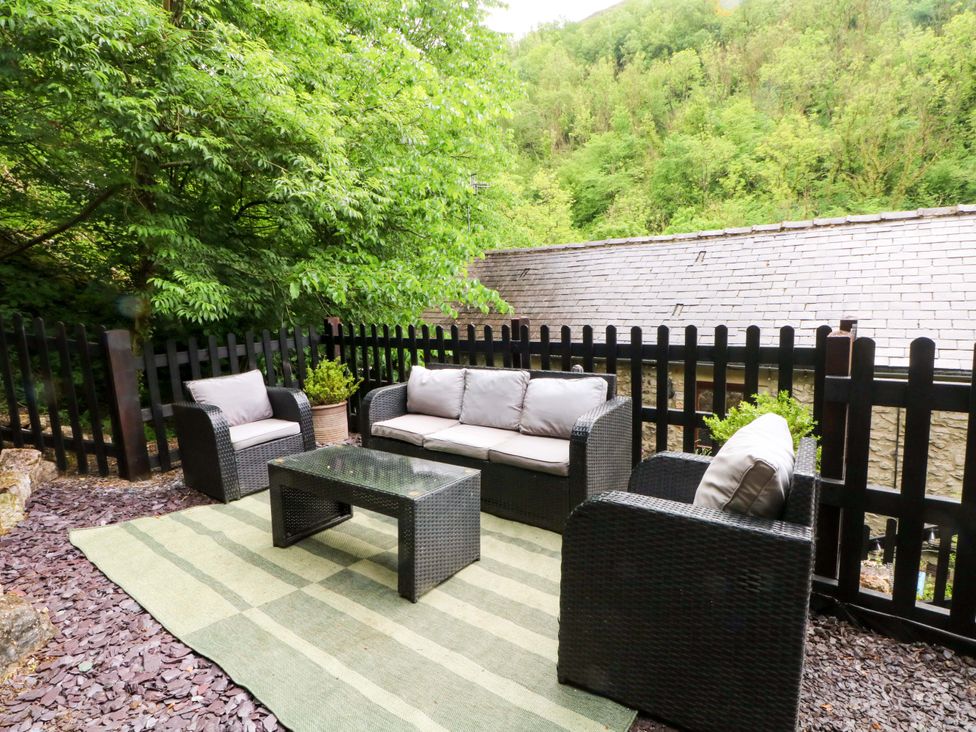 An outdoor seating area with a sofa and chairs at The Barn near Miller's Dale