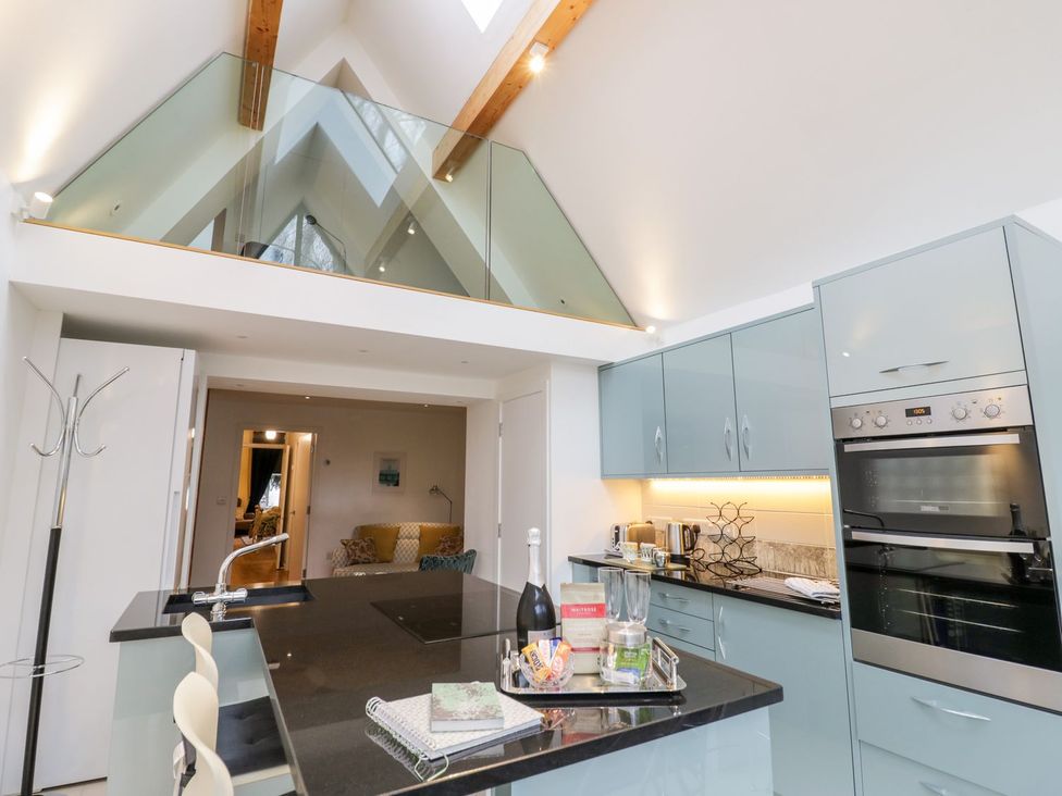 A kitchen with cabinets and appliances at Little Mornington in Malvern