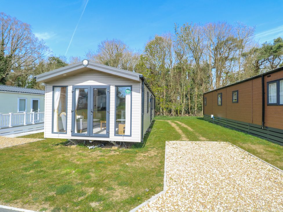 A mobile home with windows and a pathway at Mustard Pot 111 Foxburrow Hang
