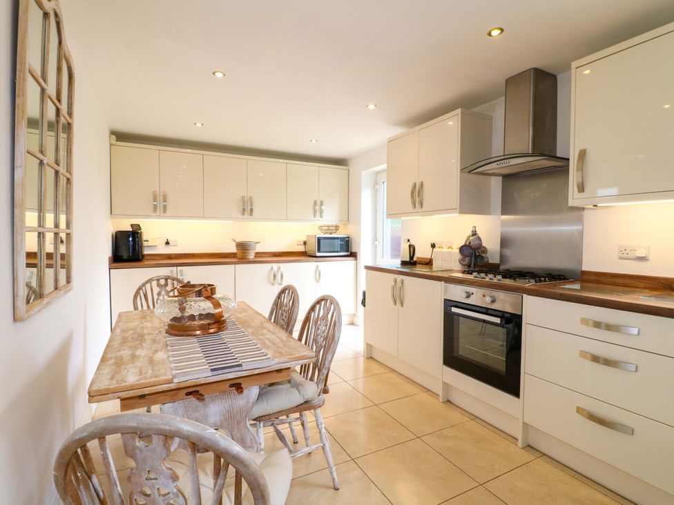 A kitchen with cabinets and appliances at 16 Temple Crescent in Nuthall