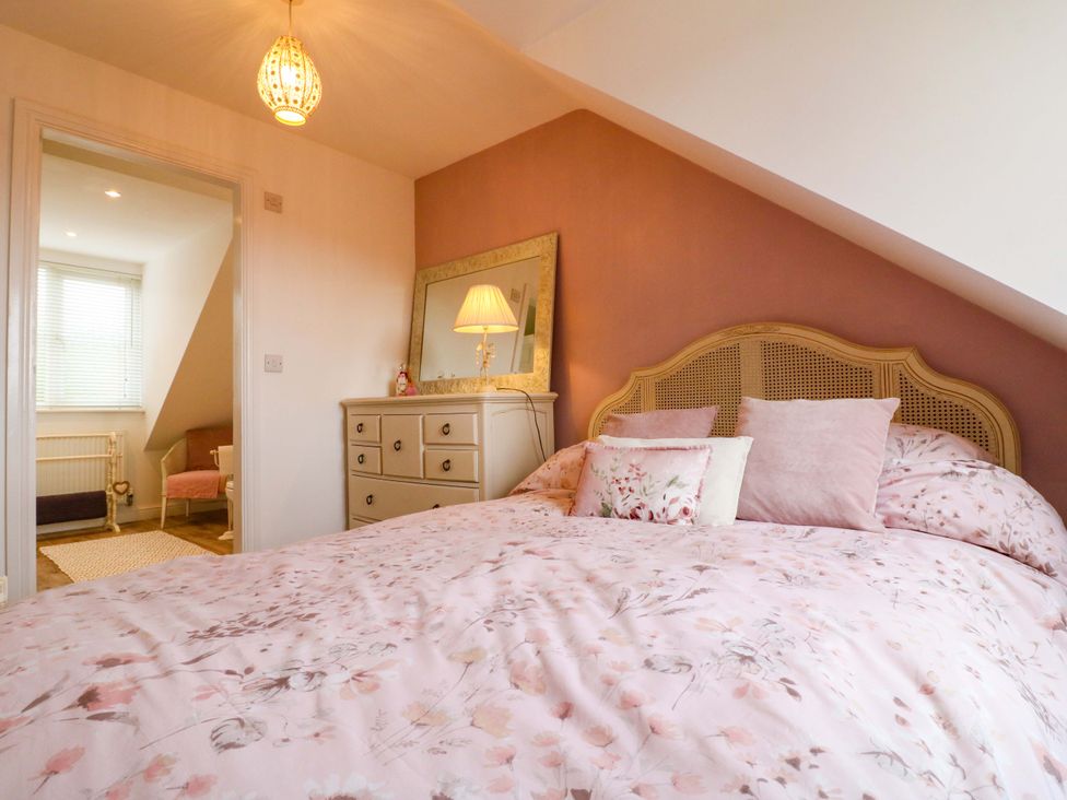 A bedroom with a bed and dresser at 16 Temple Crescent in Nuthall