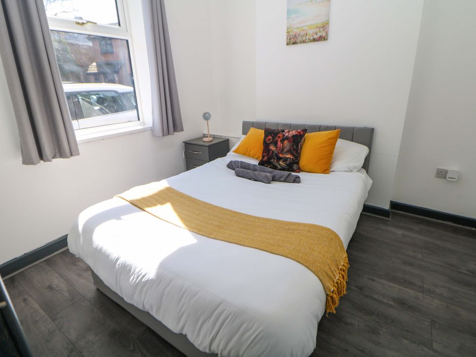 A bedroom with a bed and window at 22 Garfield Street, Stoke-on-Trent