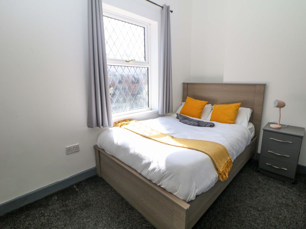 A bedroom with a bed and window at 22 Garfield Street Stoke-on-Trent