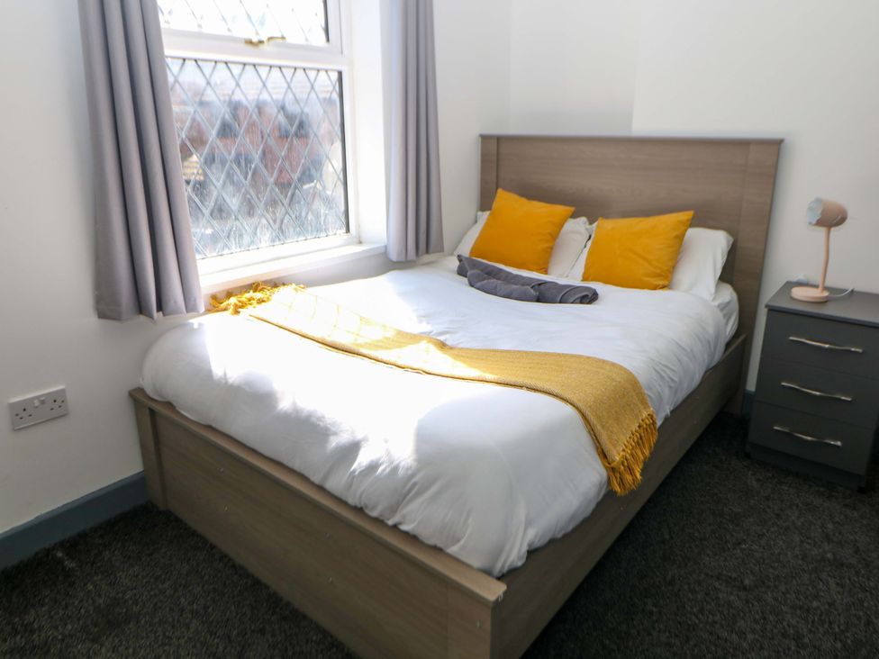 A bedroom with a bed and a window at 22 Garfield Street in Stoke-on-Trent
