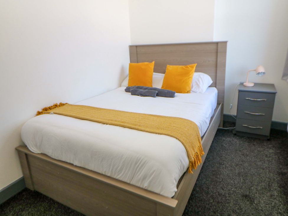 A bedroom with a bed and nightstand at 22 Garfield Street Stoke-on-Trent