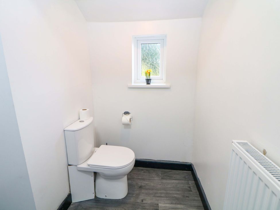 A bathroom with a toilet and window at 22 Garfield Street Stoke-on-Trent