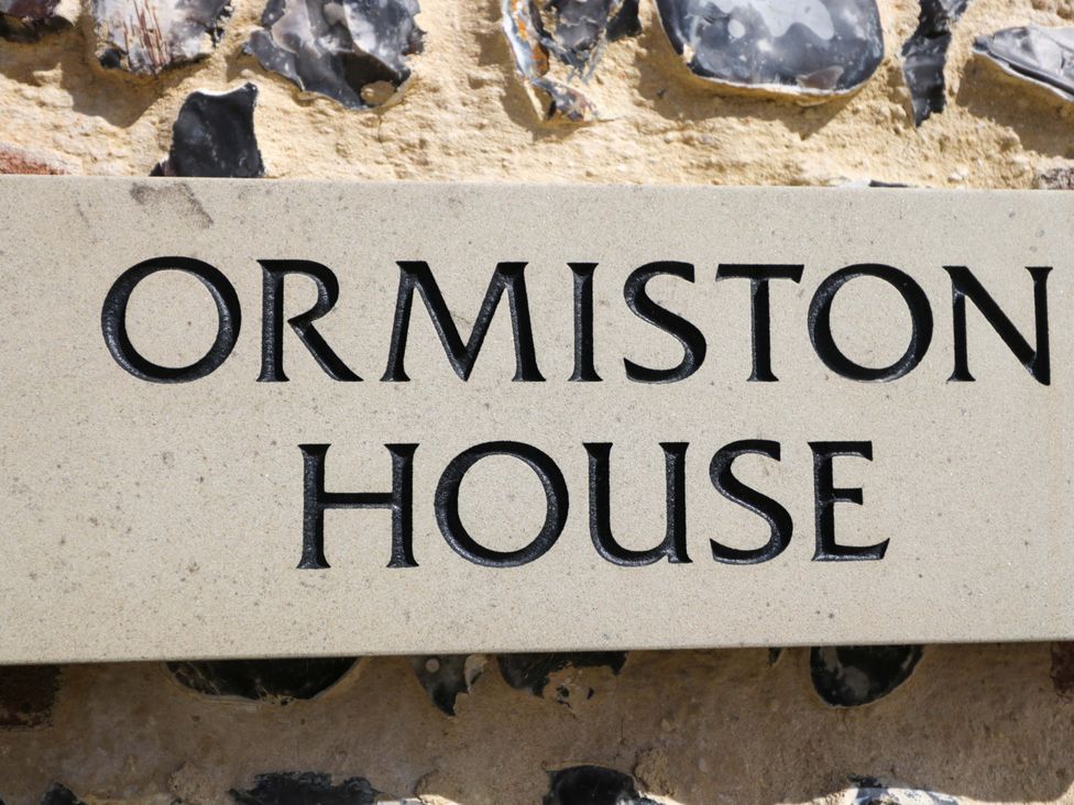 A stone sign with Ormiston House engraved in it at Ormiston House in Netheravon