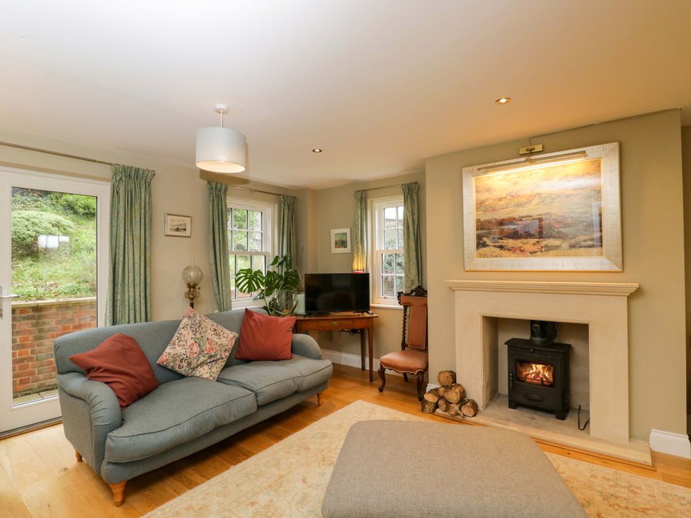A living room with a sofa and fireplace at Ormiston House Netheravon